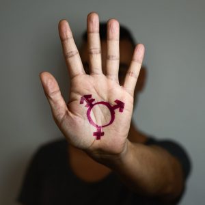 transgender symbol painted in the palm of the hand